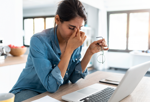 Woman stressed in front of her computer